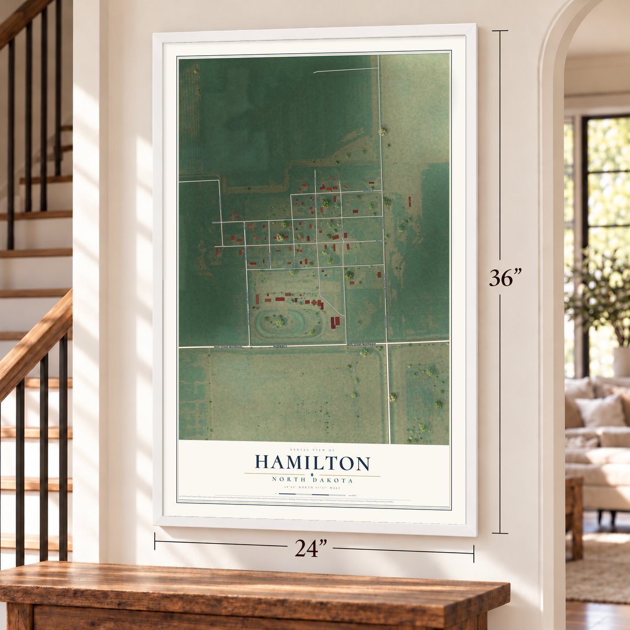 Hamilton, North Dakota map, 24 x 36 inch print in a white frame by a staircase