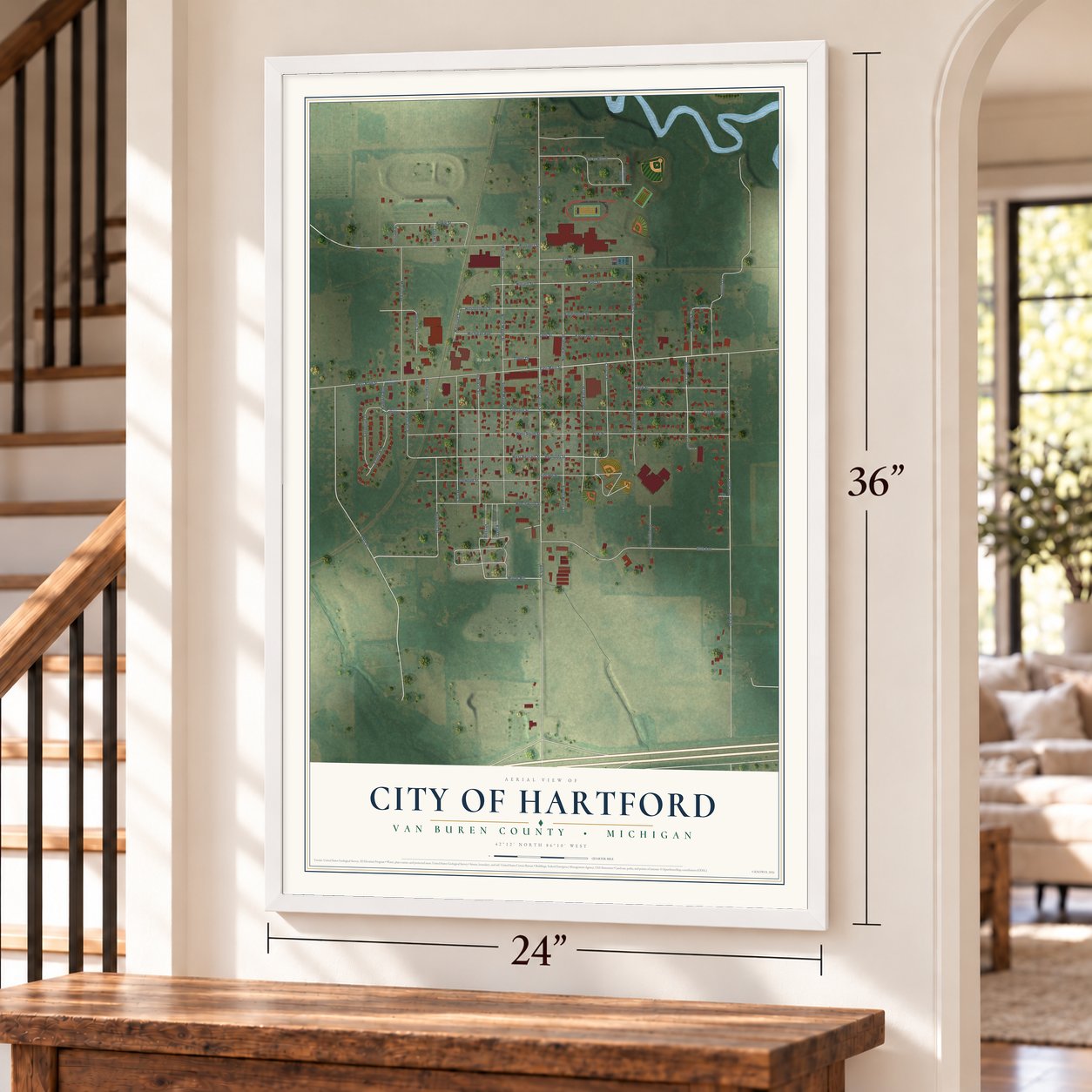 Hartford, Michigan map, 24 x 36 inch print in a white frame by a staircase