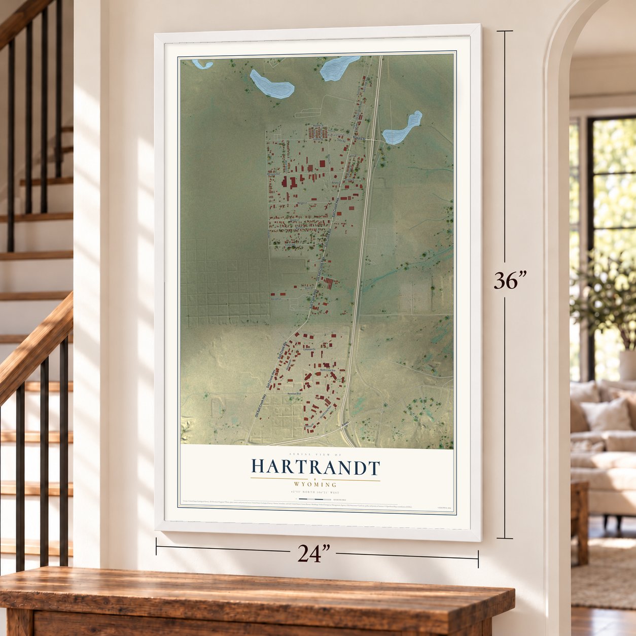 Hartrandt, Wyoming map, 24 x 36 inch print in a white frame by a staircase