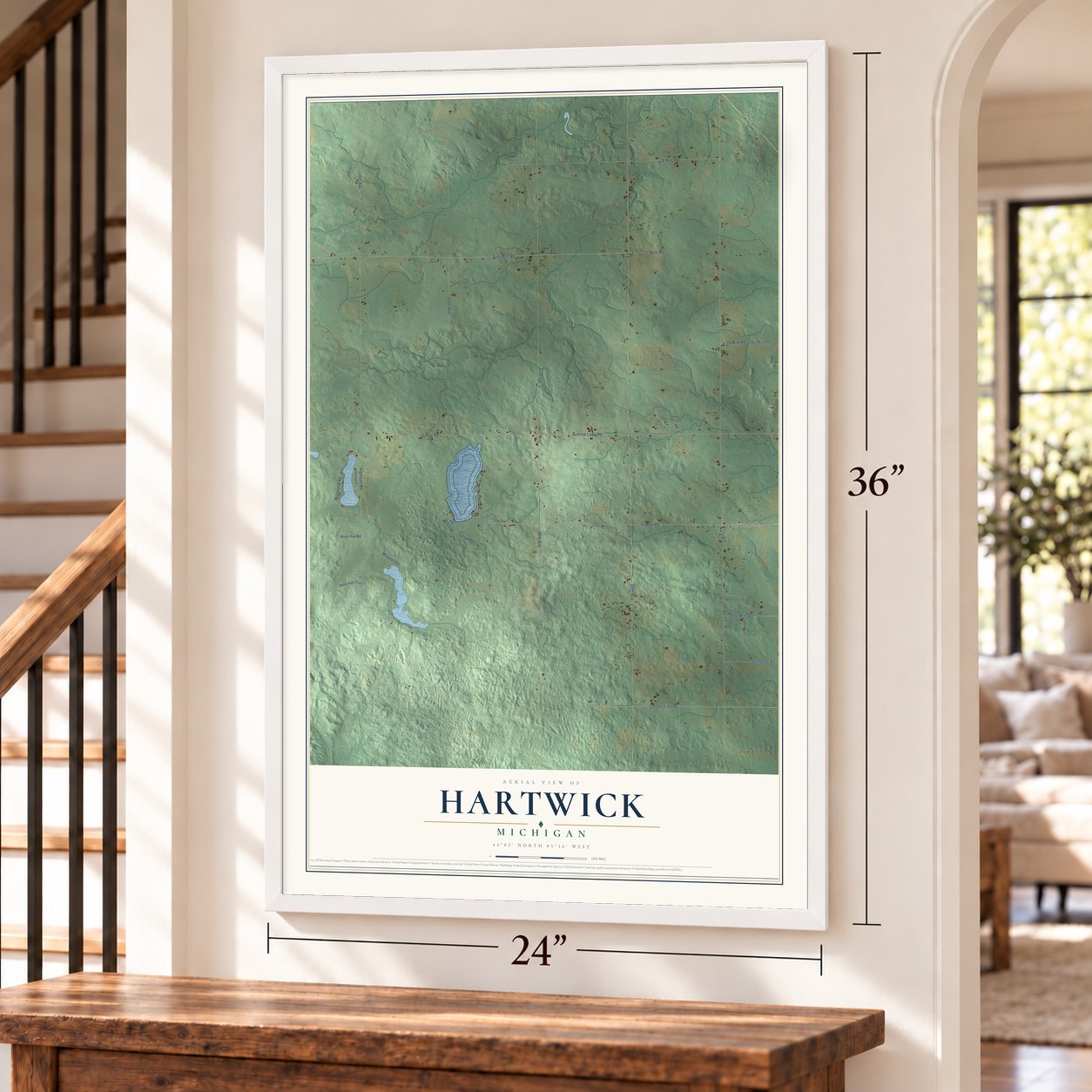 Hartwick, Michigan map, 24 x 36 inch print in a white frame by a staircase