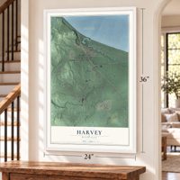 Harvey, Michigan map, 24 x 36 inch print in a white frame by a staircase