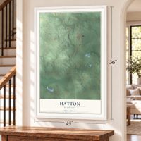 Hatton, Michigan map, 24 x 36 inch print in a white frame by a staircase