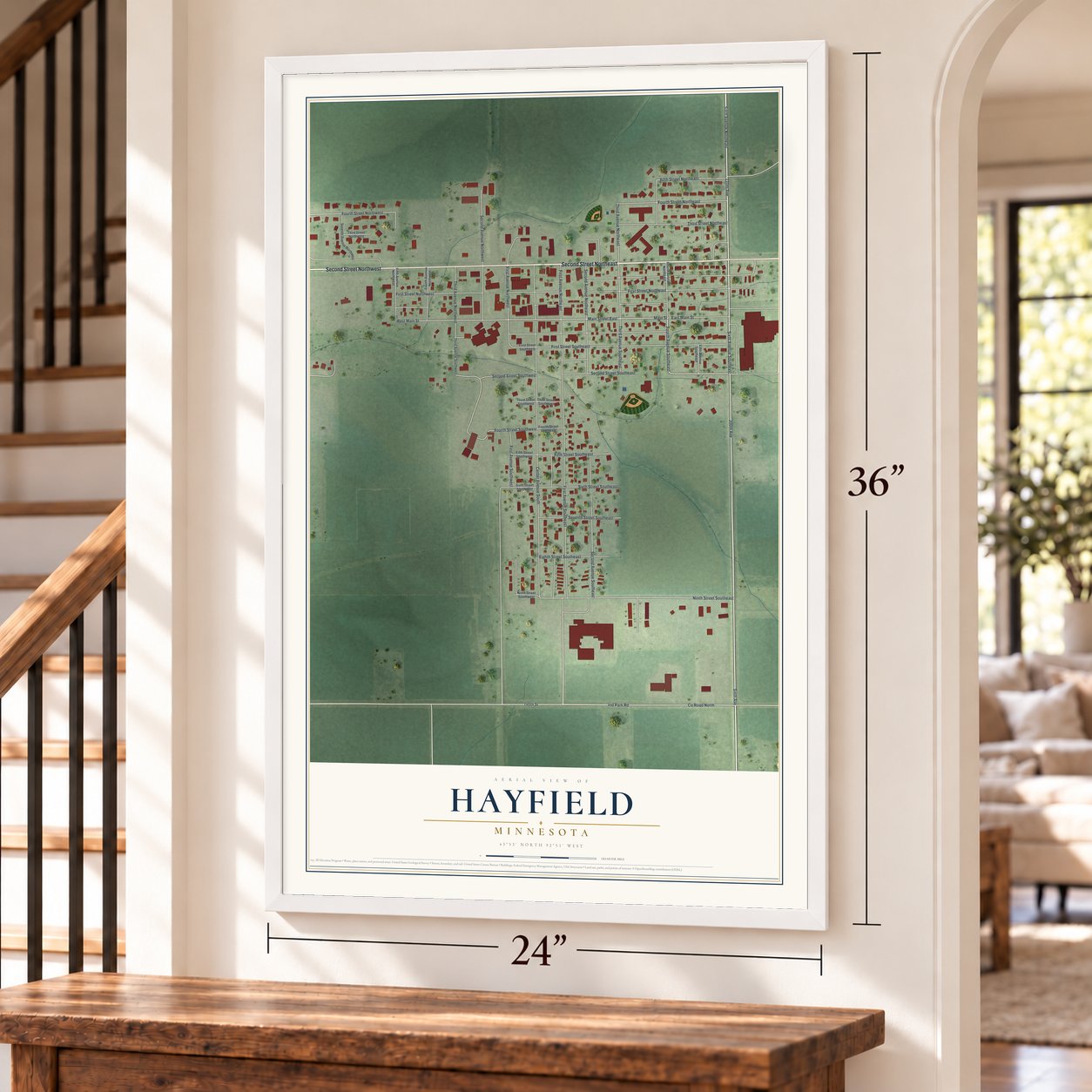 Hayfield, Minnesota map, 24 x 36 inch print in a white frame by a staircase