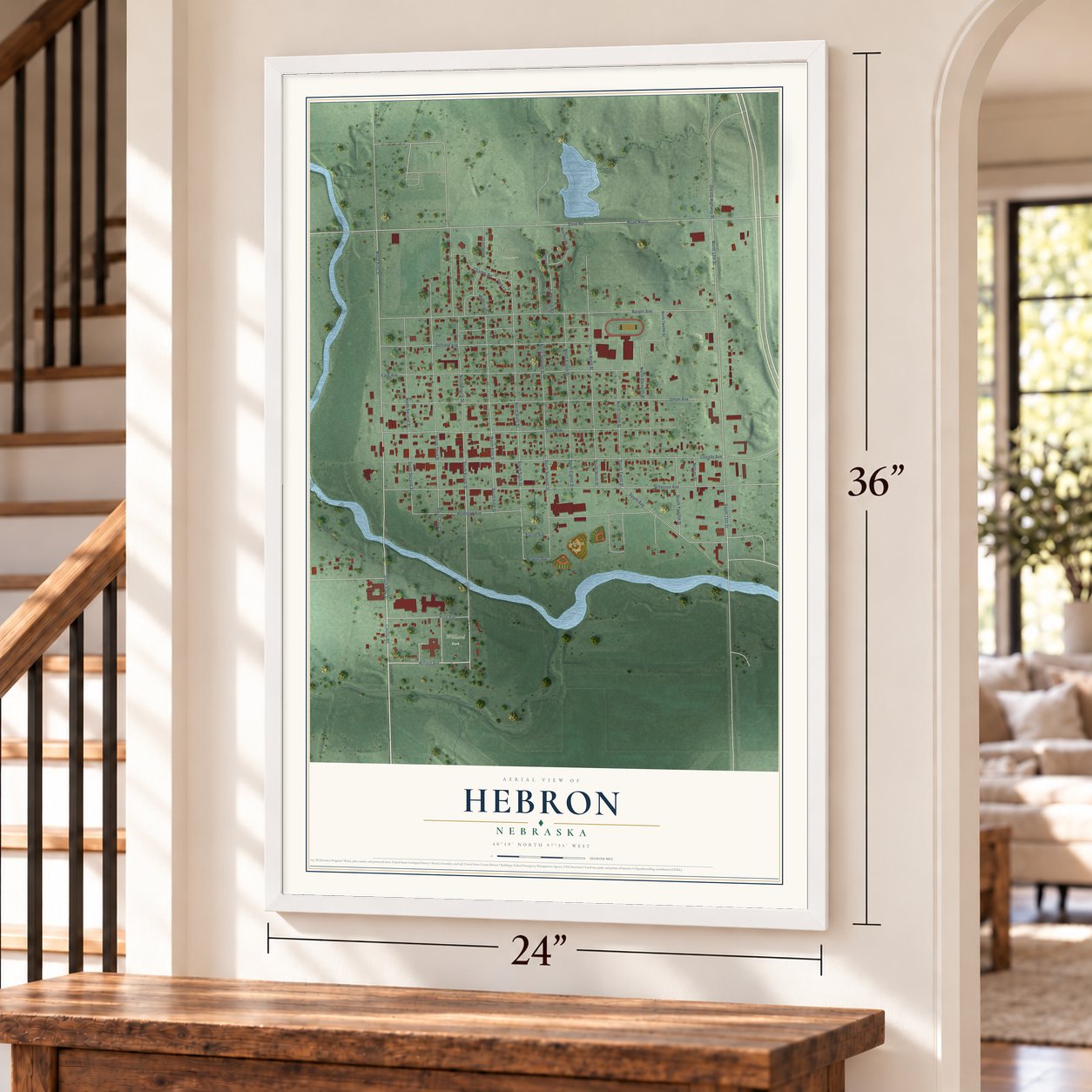 Hebron, Nebraska map, 24 x 36 inch print in a white frame by a staircase