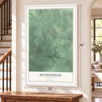 Henderson, Michigan map, 24 x 36 inch print in a white frame by a staircase