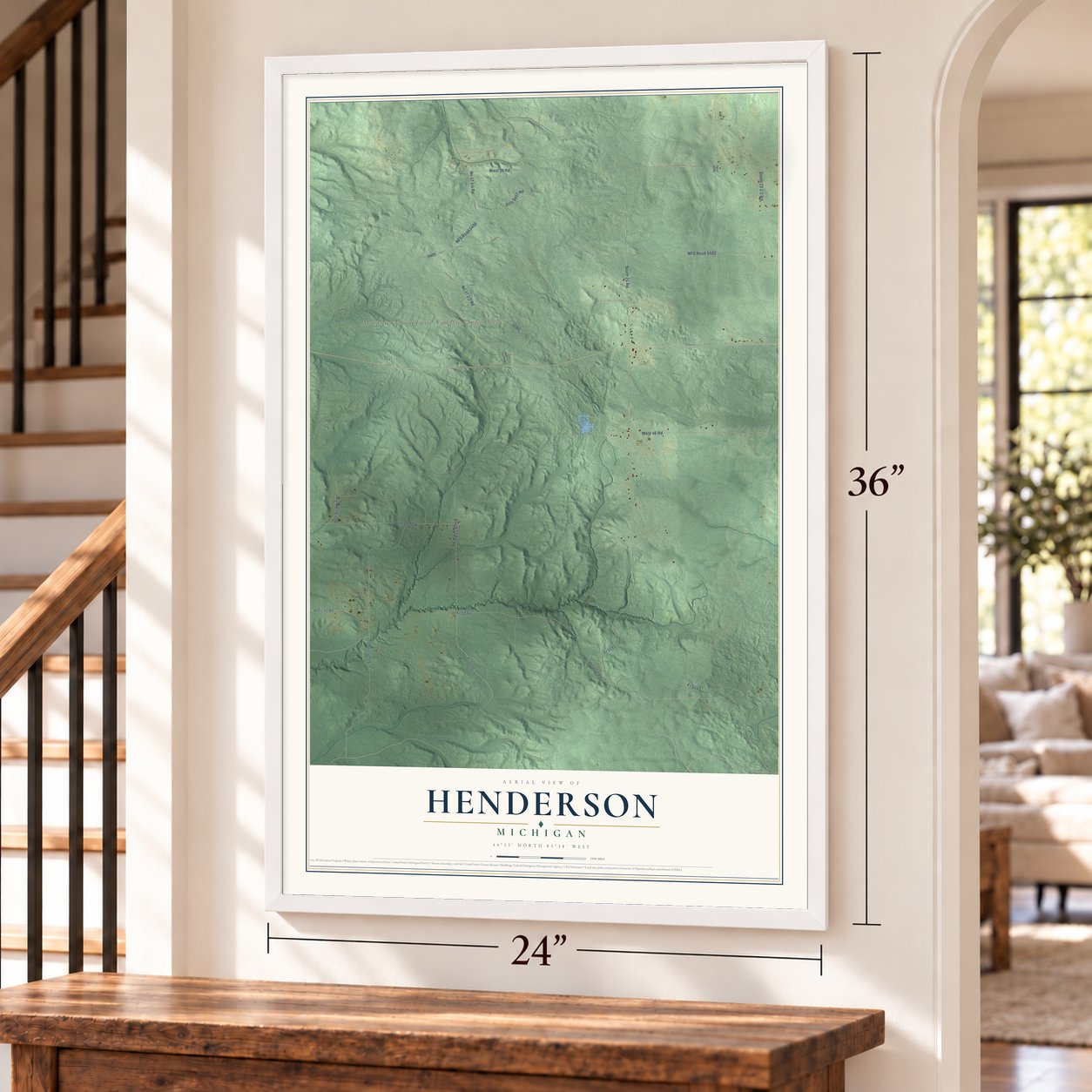 Henderson, Michigan map, 24 x 36 inch print in a white frame by a staircase