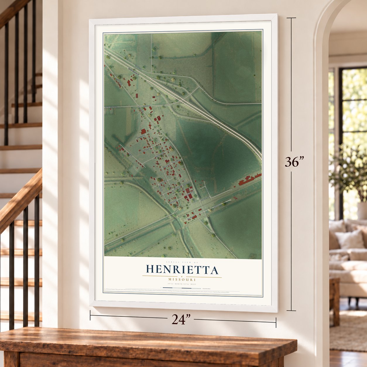 Henrietta, Missouri map, 24 x 36 inch print in a white frame by a staircase