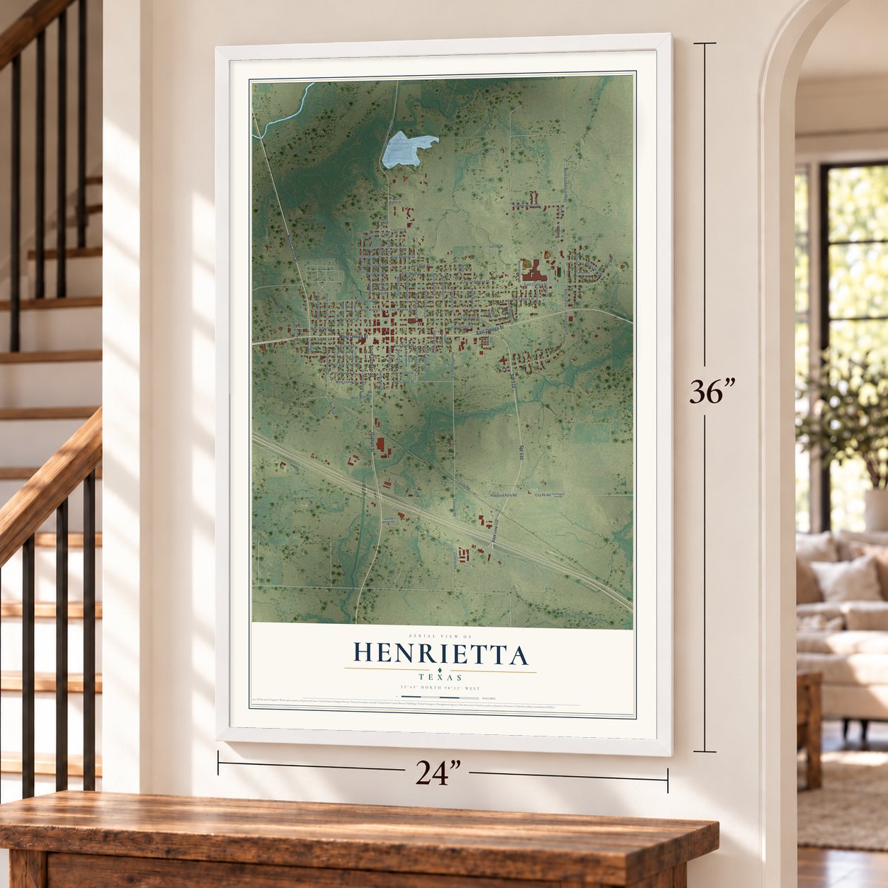 Henrietta, Texas map, 24 x 36 inch print in a white frame by a staircase
