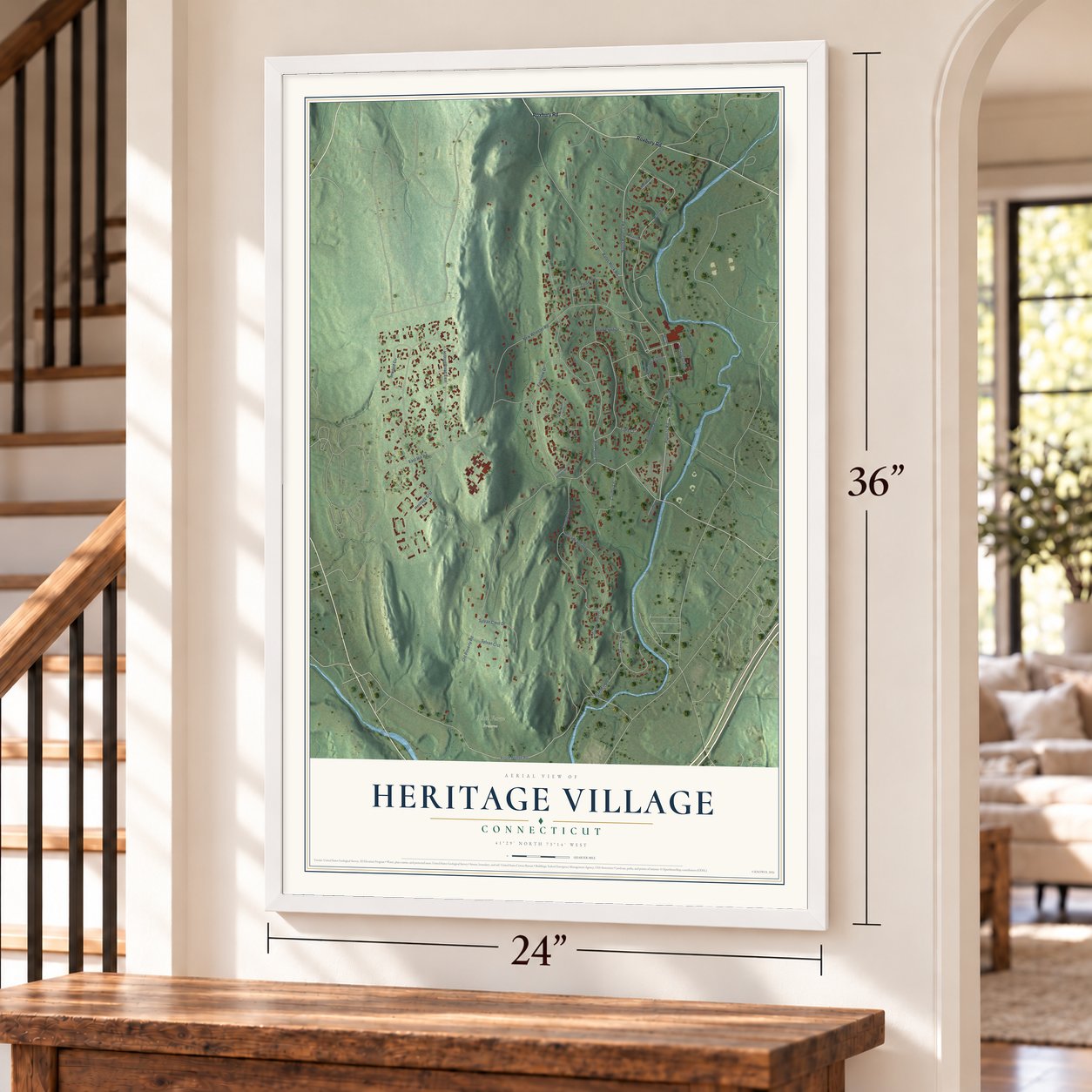 Heritage Village, Connecticut map, 24 x 36 inch print in a white frame by a staircase