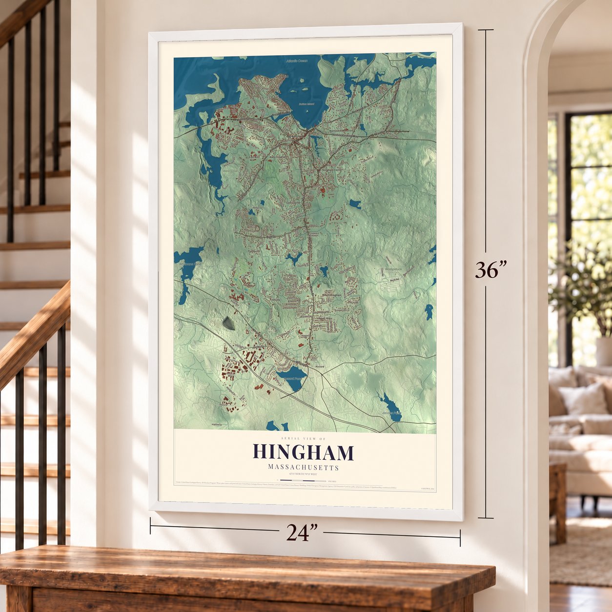 Hingham, Massachusetts map, 24 x 36 inch print in a white frame by a staircase
