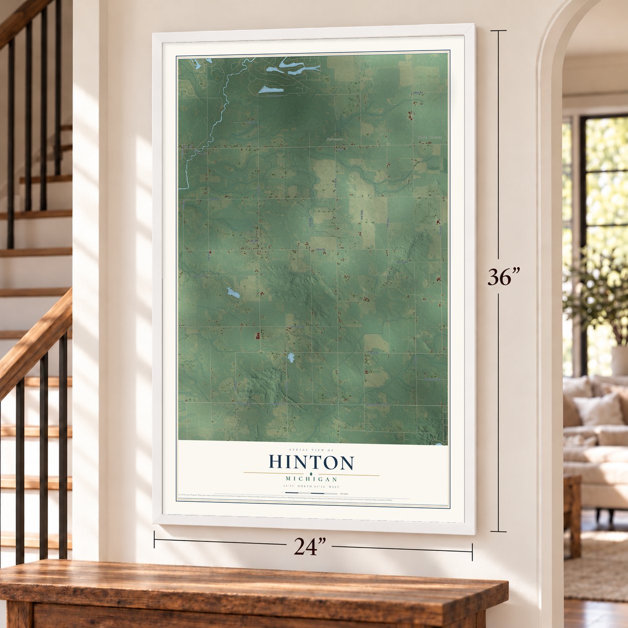 Hinton, Michigan map, 24 x 36 inch print in a white frame by a staircase