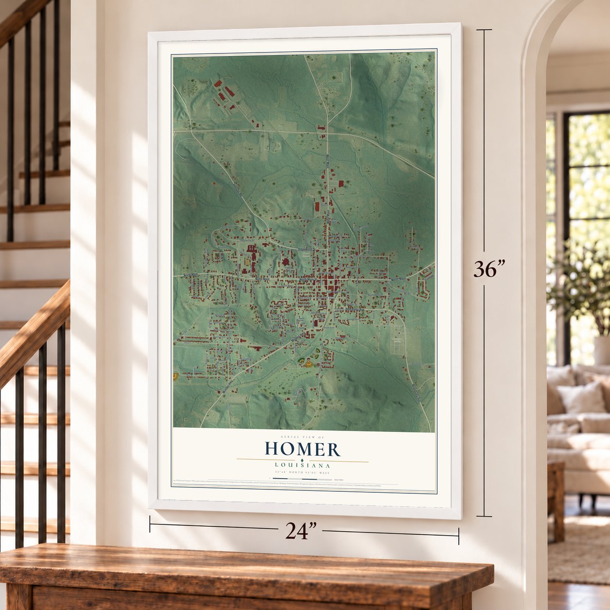 Homer, Louisiana map, 24 x 36 inch print in a white frame by a staircase