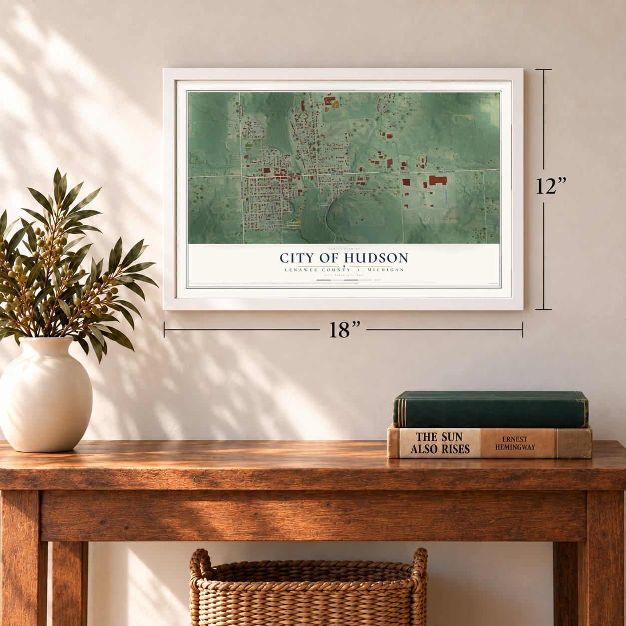 Hudson, Michigan map, 12 x 18 inch print in a white frame in an entryway
