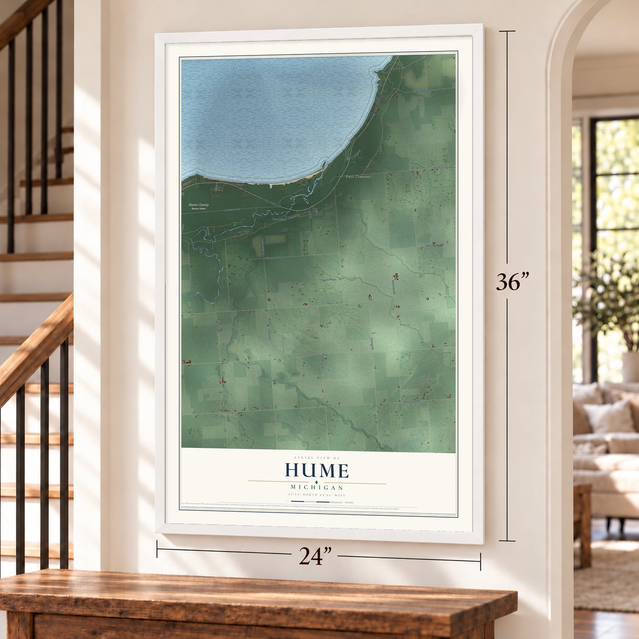 Hume, Michigan map, 24 x 36 inch print in a white frame by a staircase