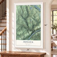 Hunlock, Pennsylvania map, 24 x 36 inch print in a white frame by a staircase