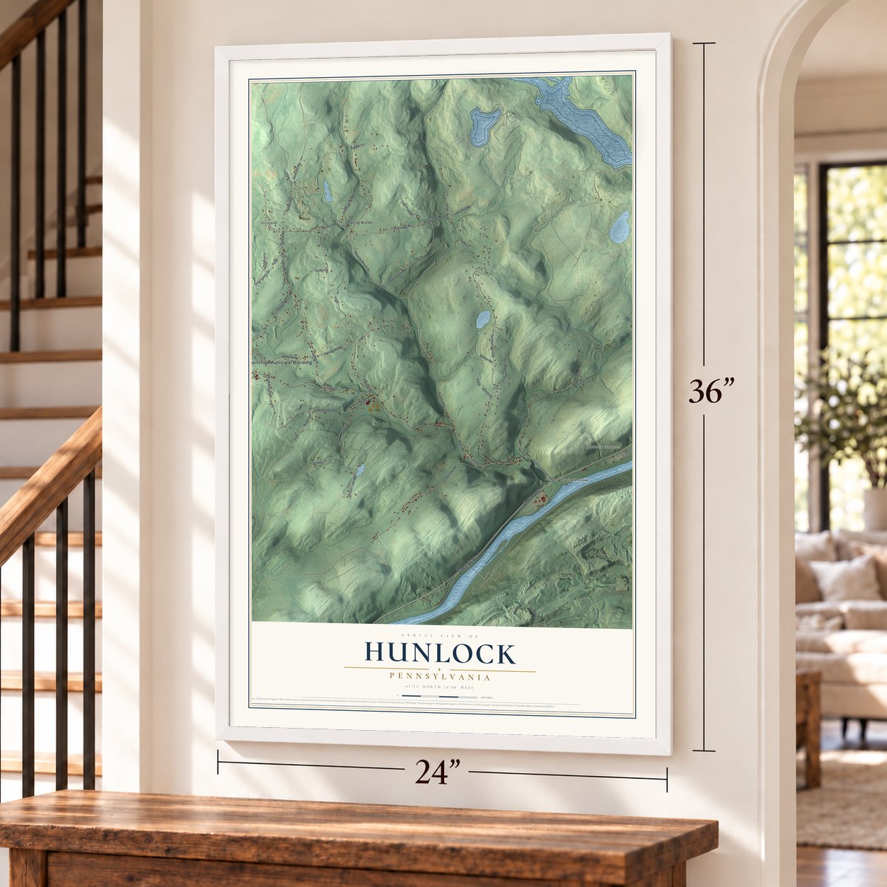 Hunlock, Pennsylvania map, 24 x 36 inch print in a white frame by a staircase