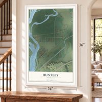 Huntley, Montana map, 24 x 36 inch print in a white frame by a staircase