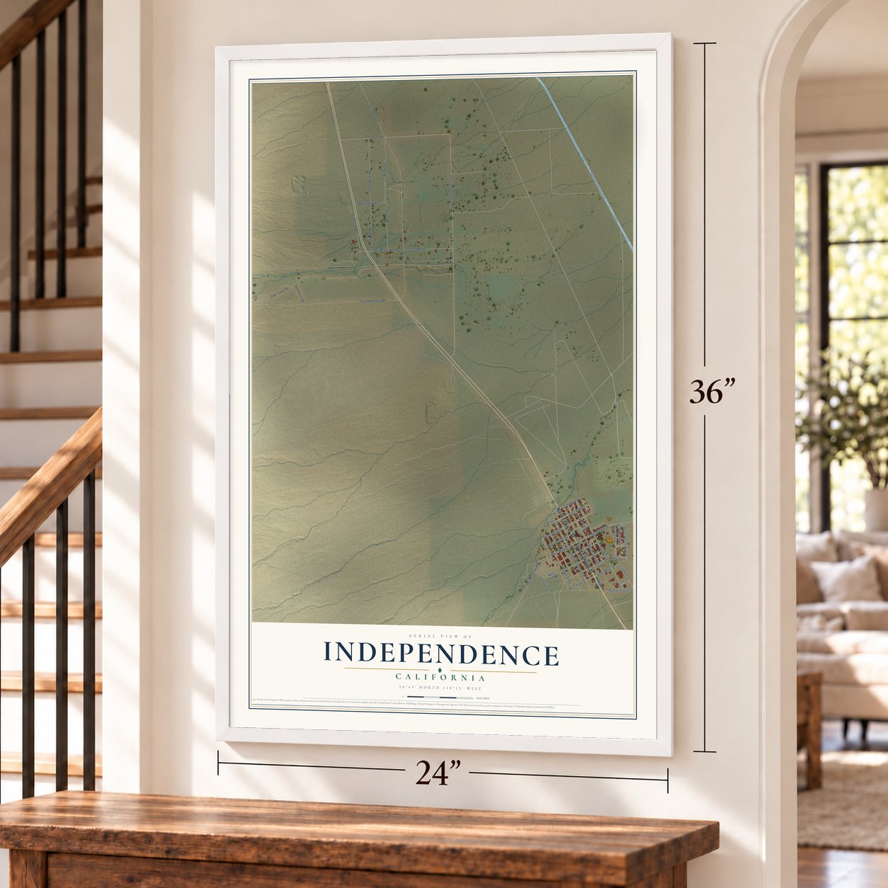 Independence, California map, 24 x 36 inch print in a white frame by a staircase