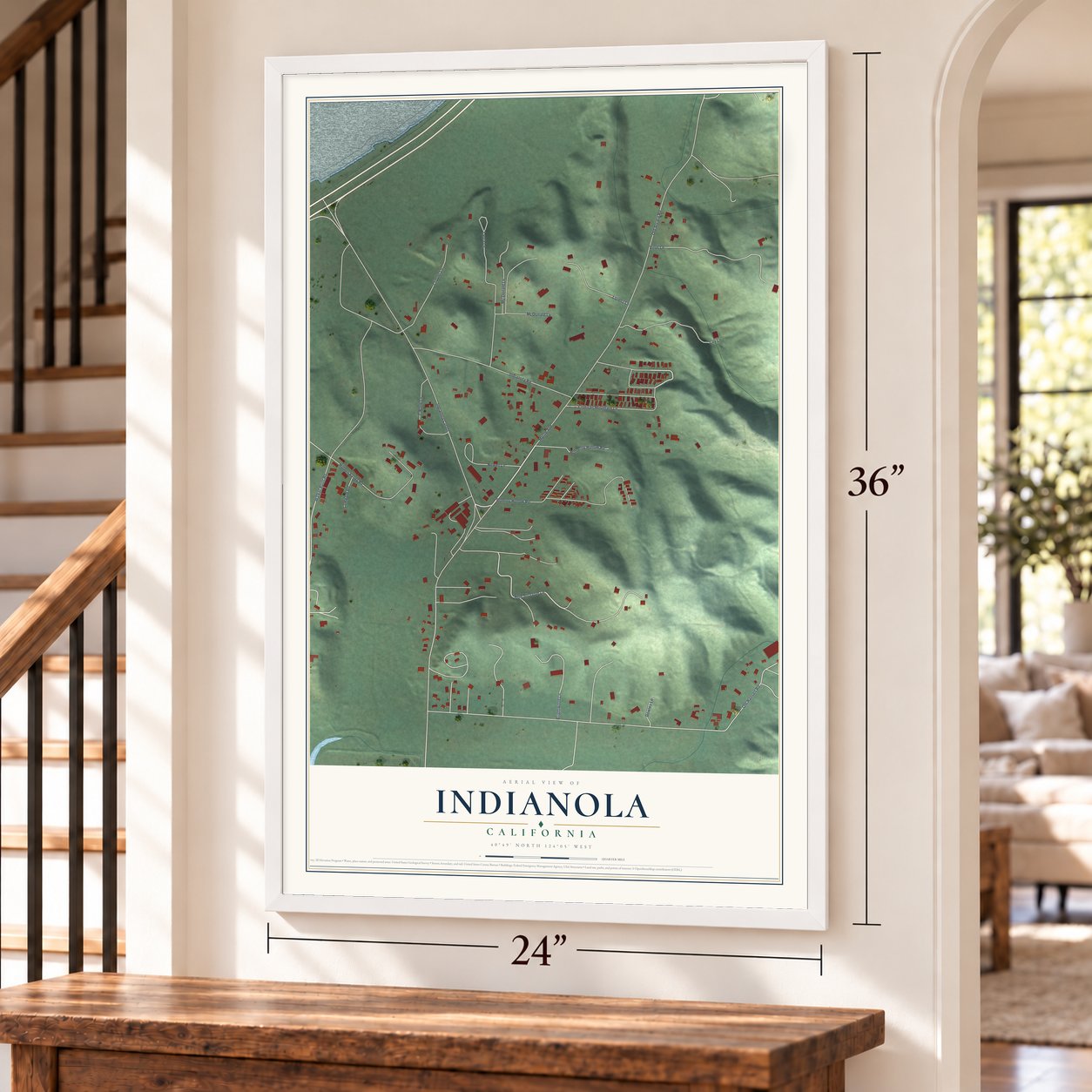 Indianola, California map, 24 x 36 inch print in a white frame by a staircase