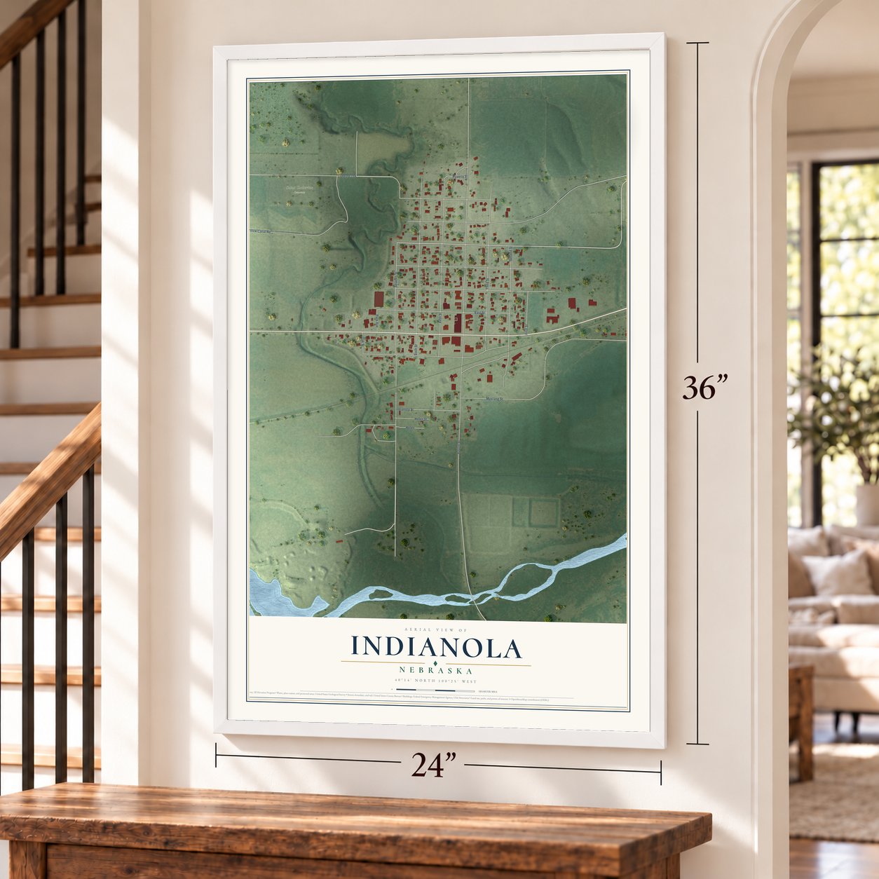 Indianola, Nebraska map, 24 x 36 inch print in a white frame by a staircase