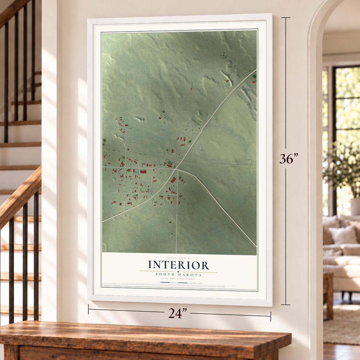 Interior, South Dakota map, 24 x 36 inch print in a white frame by a staircase