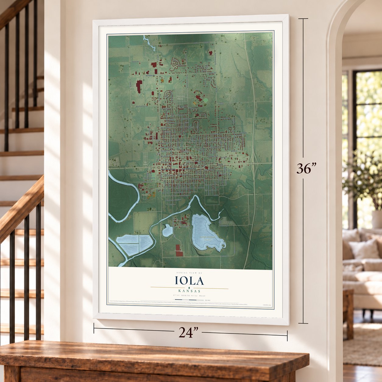 Iola, Kansas map, 24 x 36 inch print in a white frame by a staircase