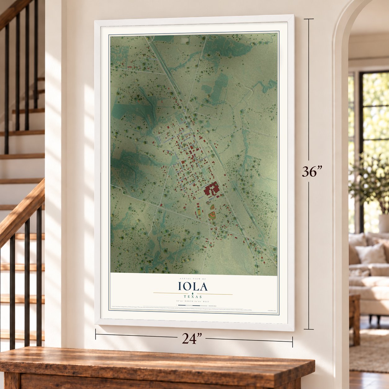 Iola, Texas map, 24 x 36 inch print in a white frame by a staircase