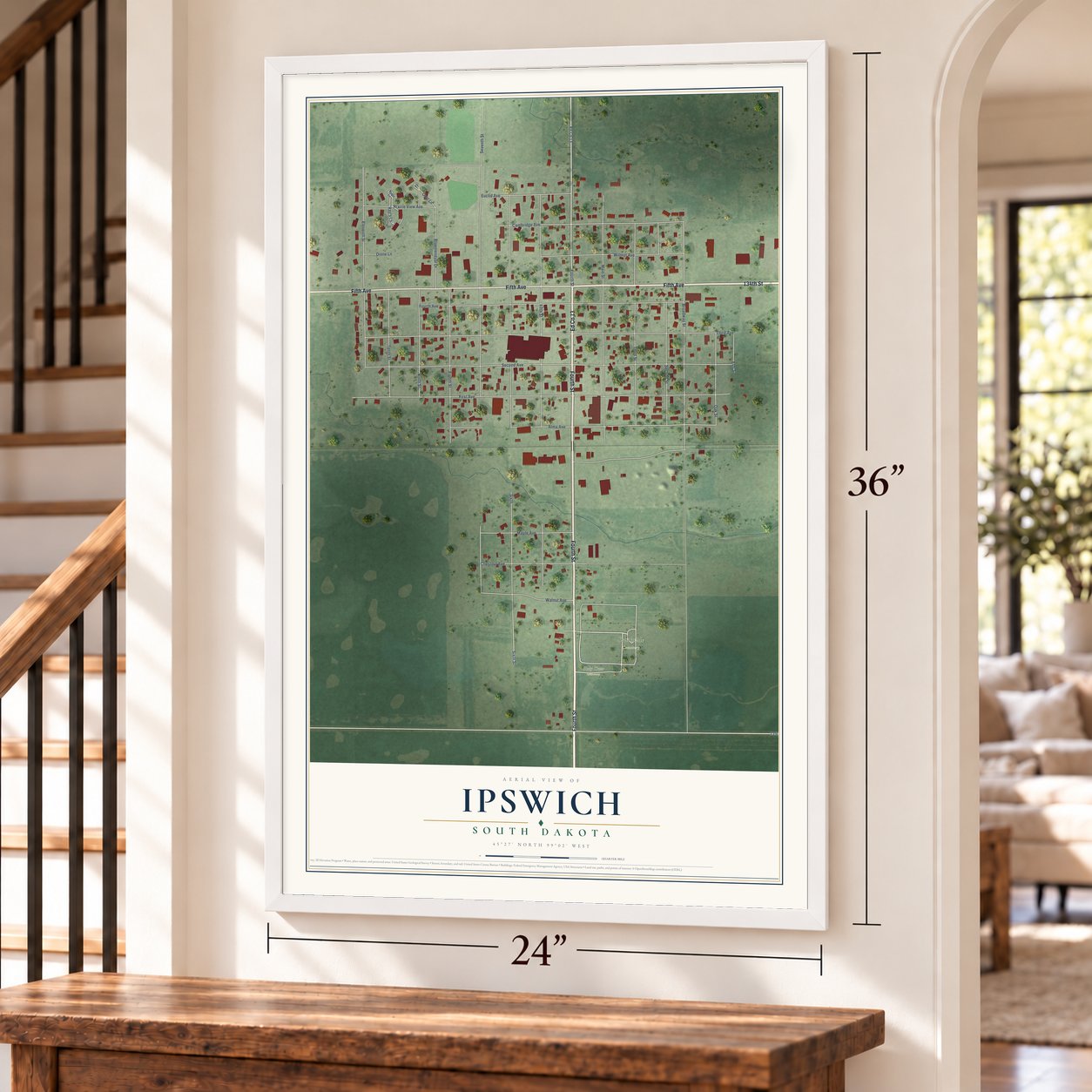 Ipswich, South Dakota map, 24 x 36 inch print in a white frame by a staircase