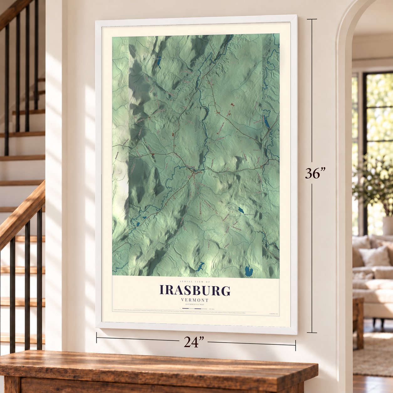 Irasburg, Vermont map, 24 x 36 inch print in a white frame by a staircase