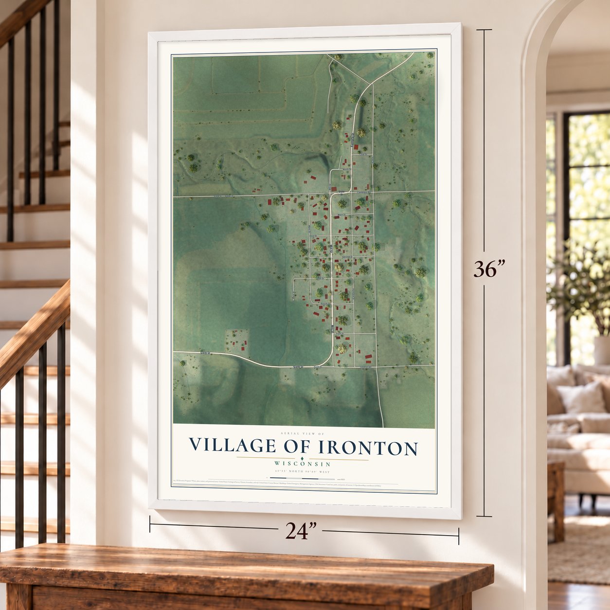 Ironton, Wisconsin map, 24 x 36 inch print in a white frame by a staircase