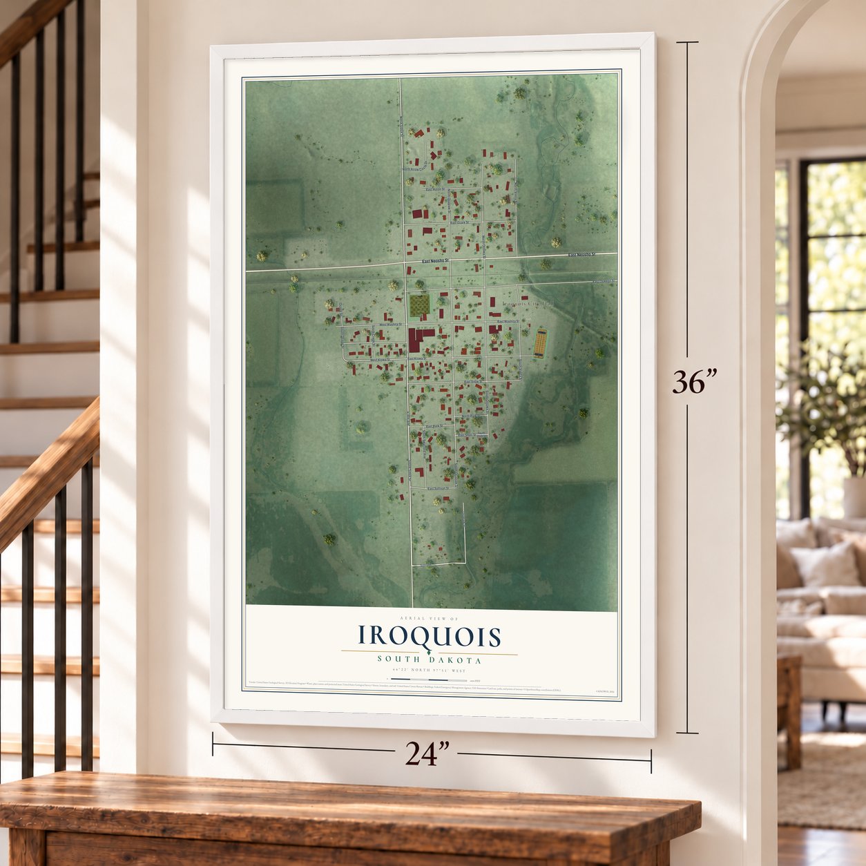 Iroquois, South Dakota map, 24 x 36 inch print in a white frame by a staircase