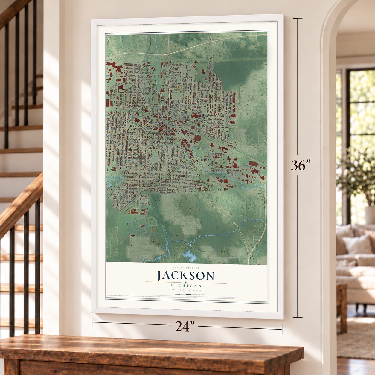 Jackson, Michigan map, 24 x 36 inch print in a white frame by a staircase