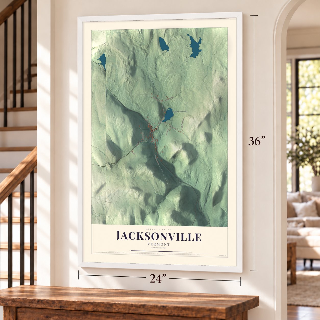 Jacksonville, Vermont map, 24 x 36 inch print in a white frame by a staircase