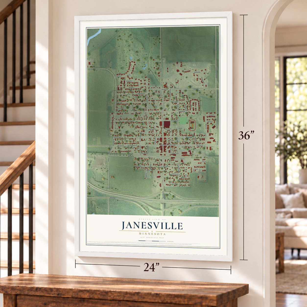 Janesville, Minnesota map, 24 x 36 inch print in a white frame by a staircase
