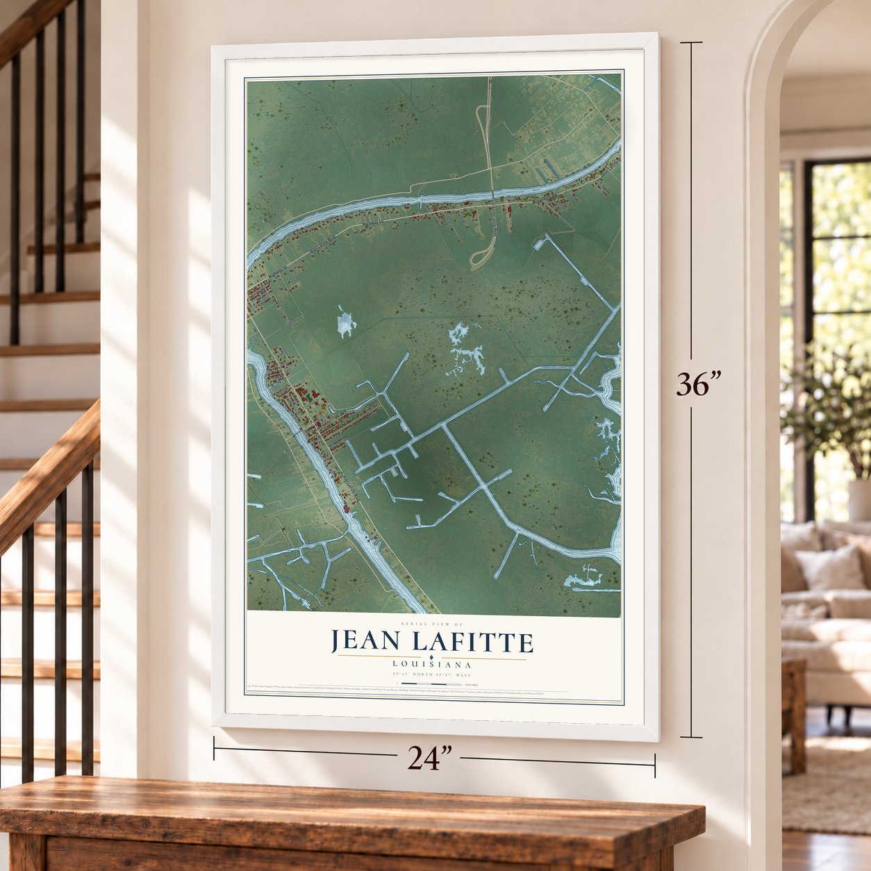 Jean Lafitte, Louisiana map, 24 x 36 inch print in a white frame by a staircase