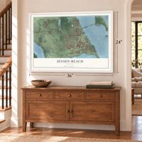 Jensen Beach, Florida map, 24 x 36 inch print in a white frame above a dresser by a staircase