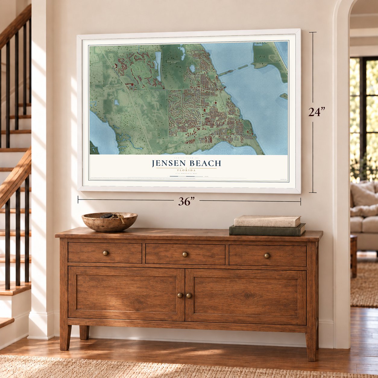 Jensen Beach, Florida map, 24 x 36 inch print in a white frame above a dresser by a staircase