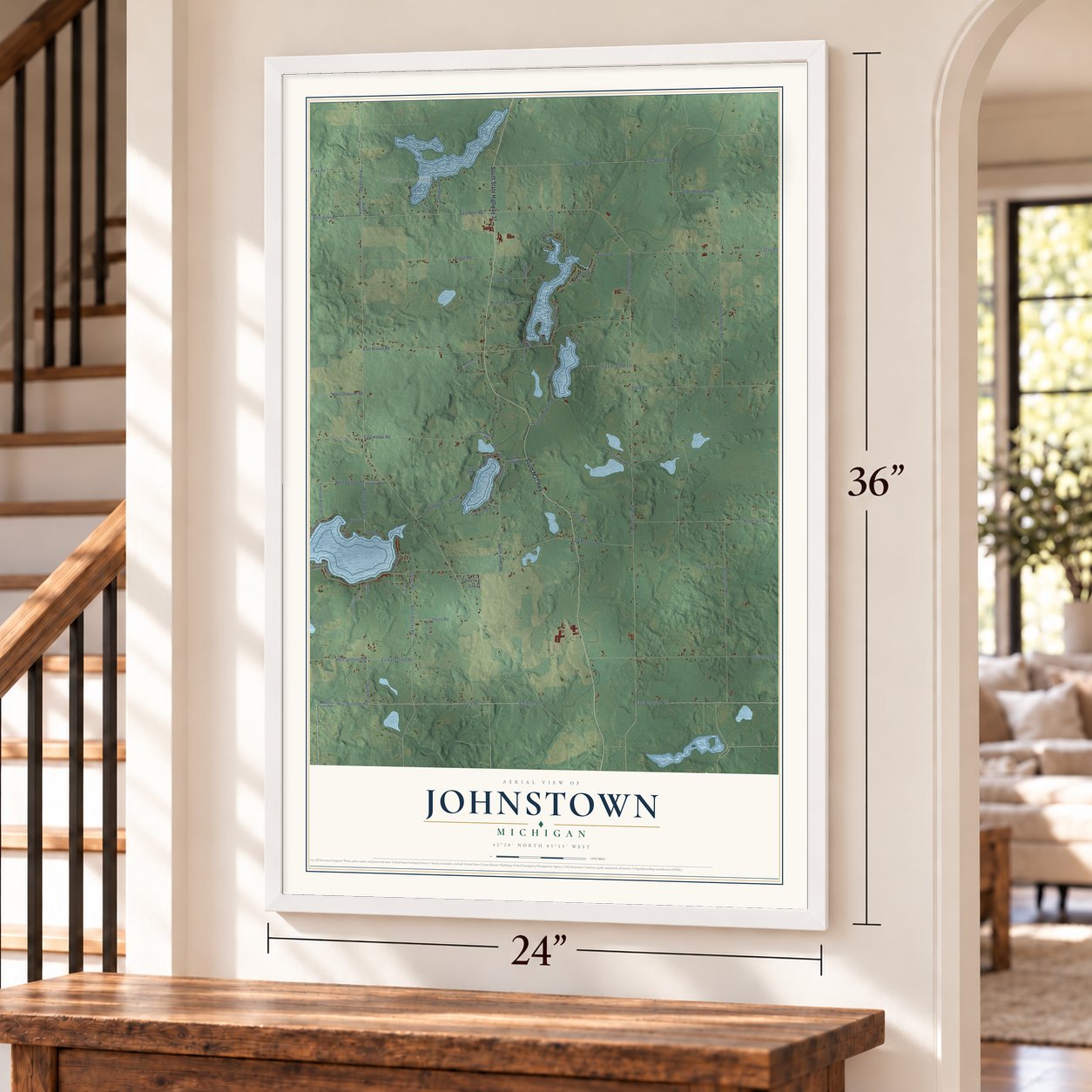 Johnstown, Michigan map, 24 x 36 inch print in a white frame by a staircase