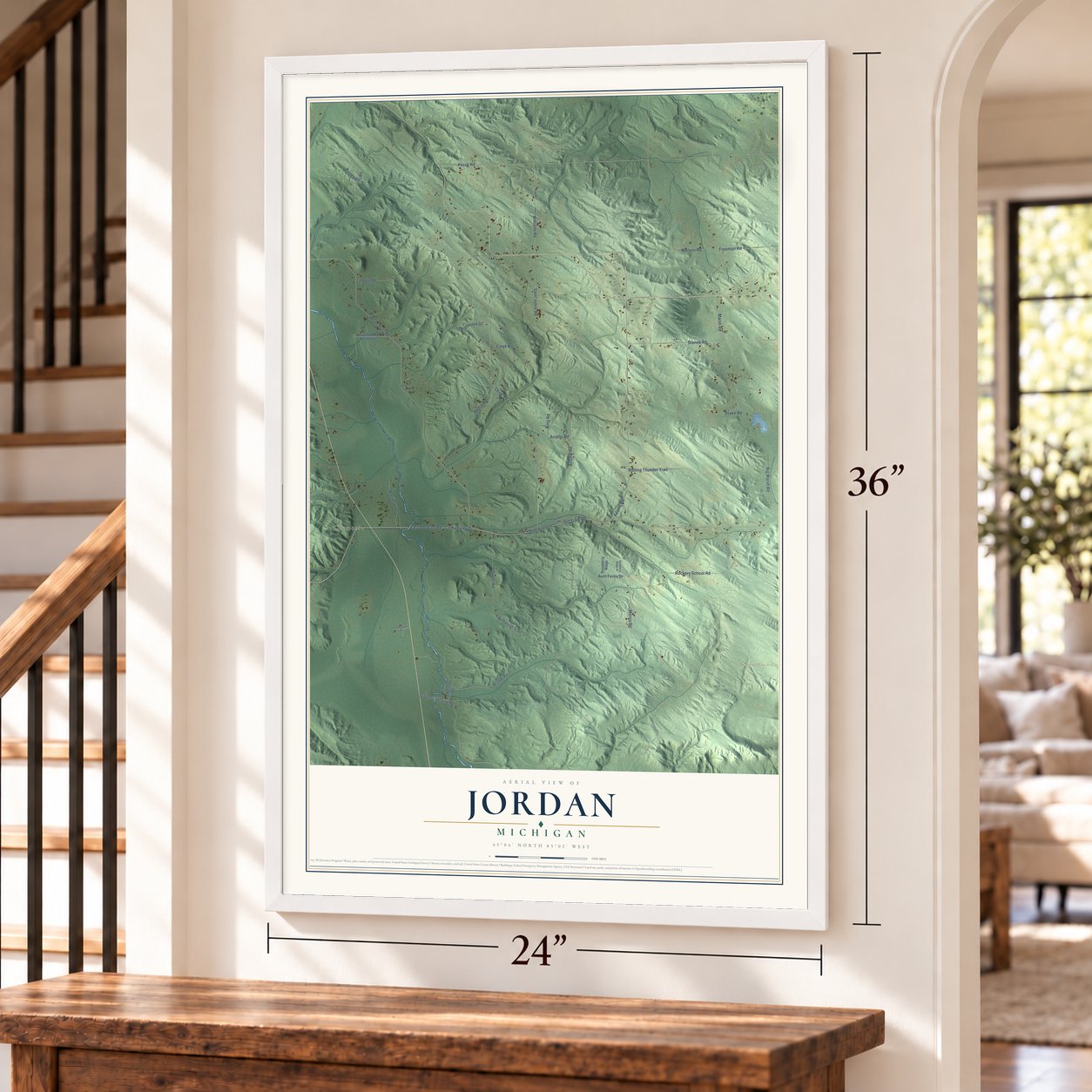 Jordan, Michigan map, 24 x 36 inch print in a white frame by a staircase