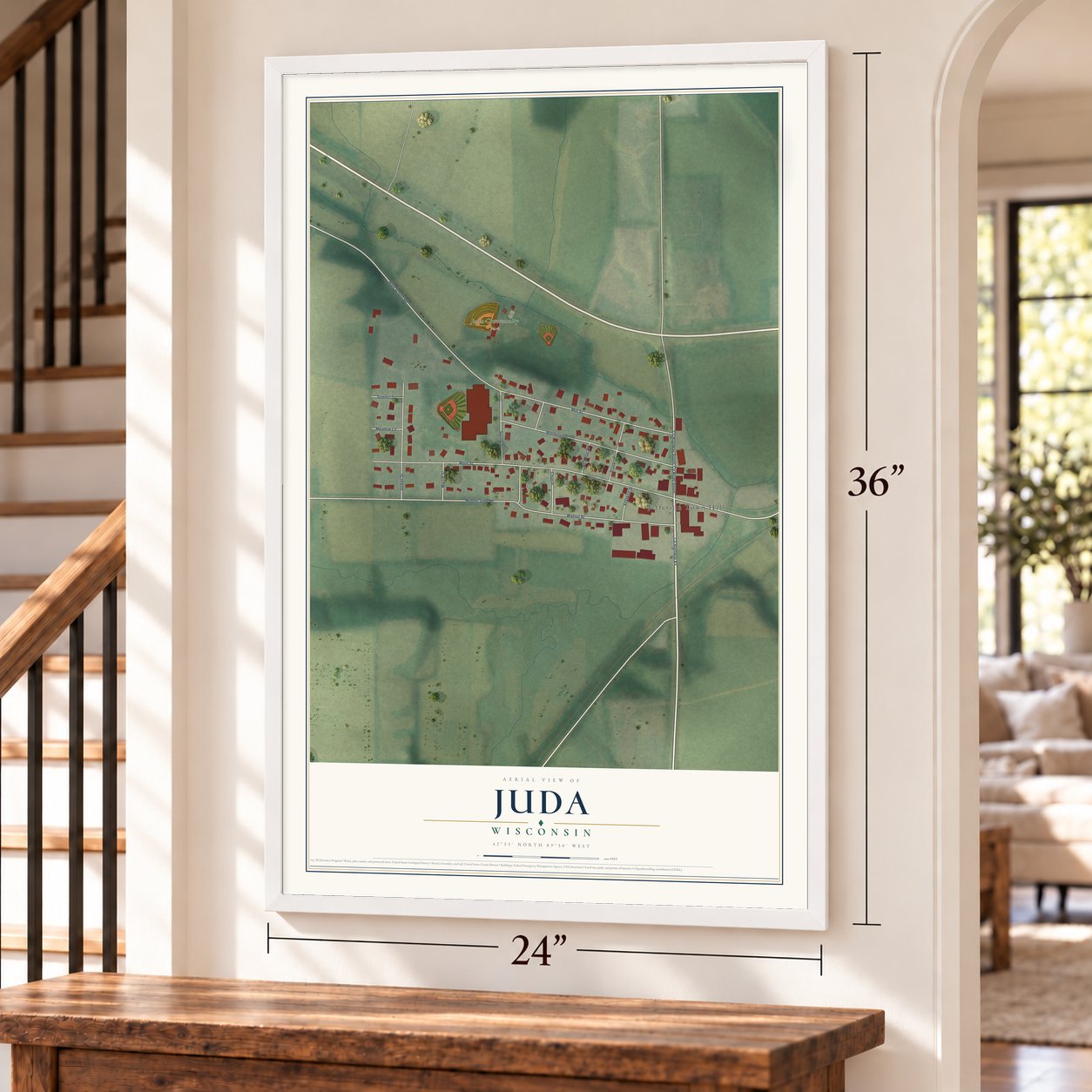 Juda, Wisconsin map, 24 x 36 inch print in a white frame by a staircase
