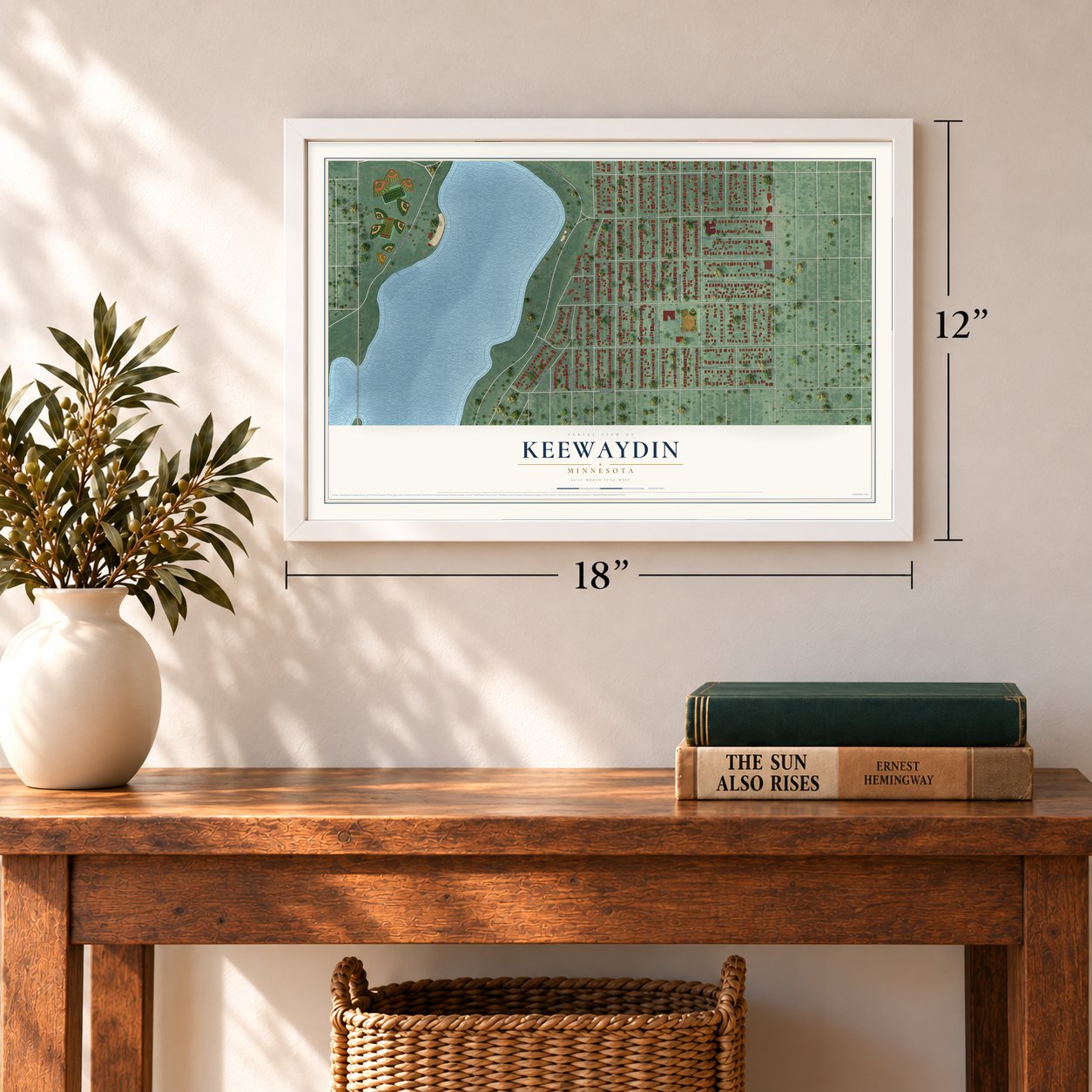 Keewaydin, Minnesota map, 12 x 18 inch print in a white frame in an entryway