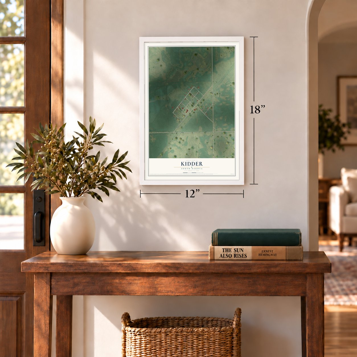 Kidder, South Dakota map, 12 x 18 inch print in a white frame in an entryway