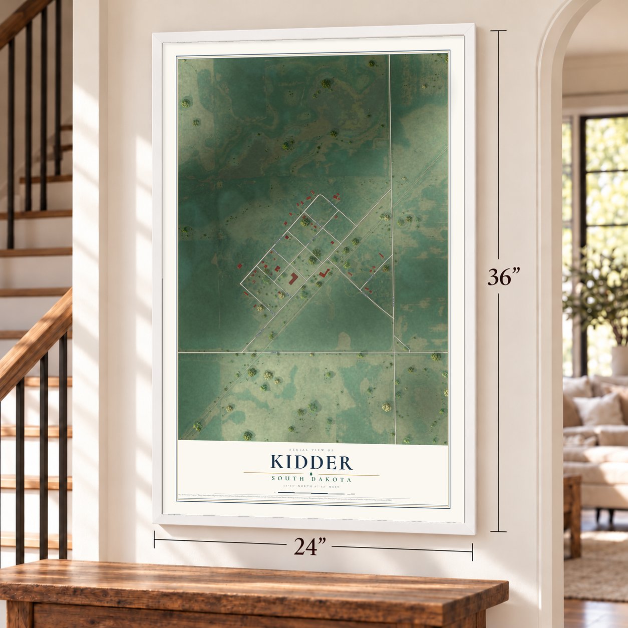Kidder, South Dakota map, 24 x 36 inch print in a white frame by a staircase