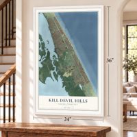 Kill Devil Hills, North Carolina map, 24 x 36 inch print in a white frame by a staircase