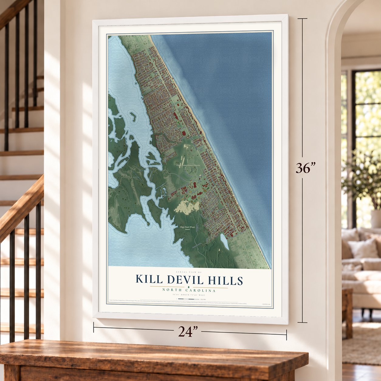Kill Devil Hills, North Carolina map, 24 x 36 inch print in a white frame by a staircase