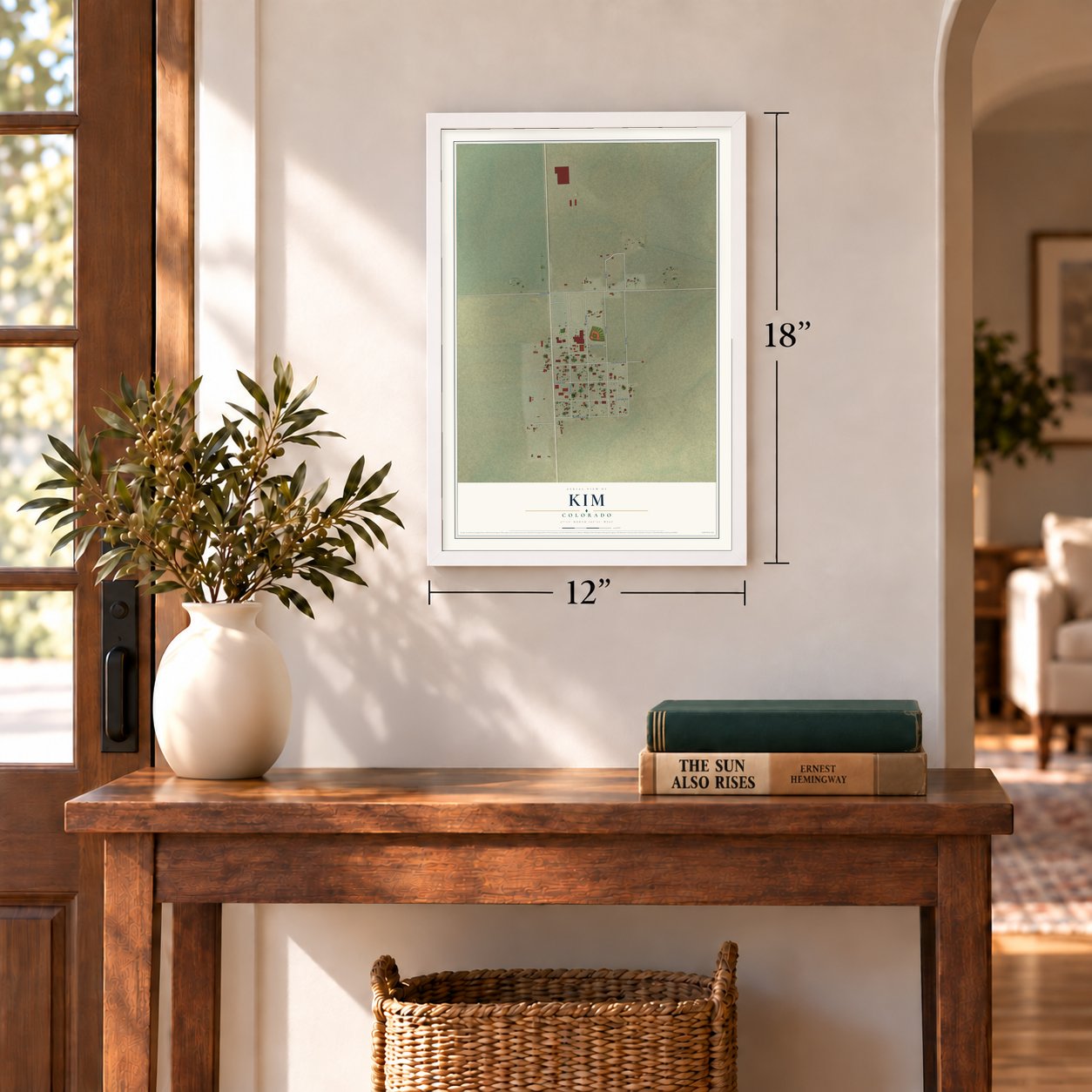 Kim, Colorado map, 12 x 18 inch print in a white frame in an entryway