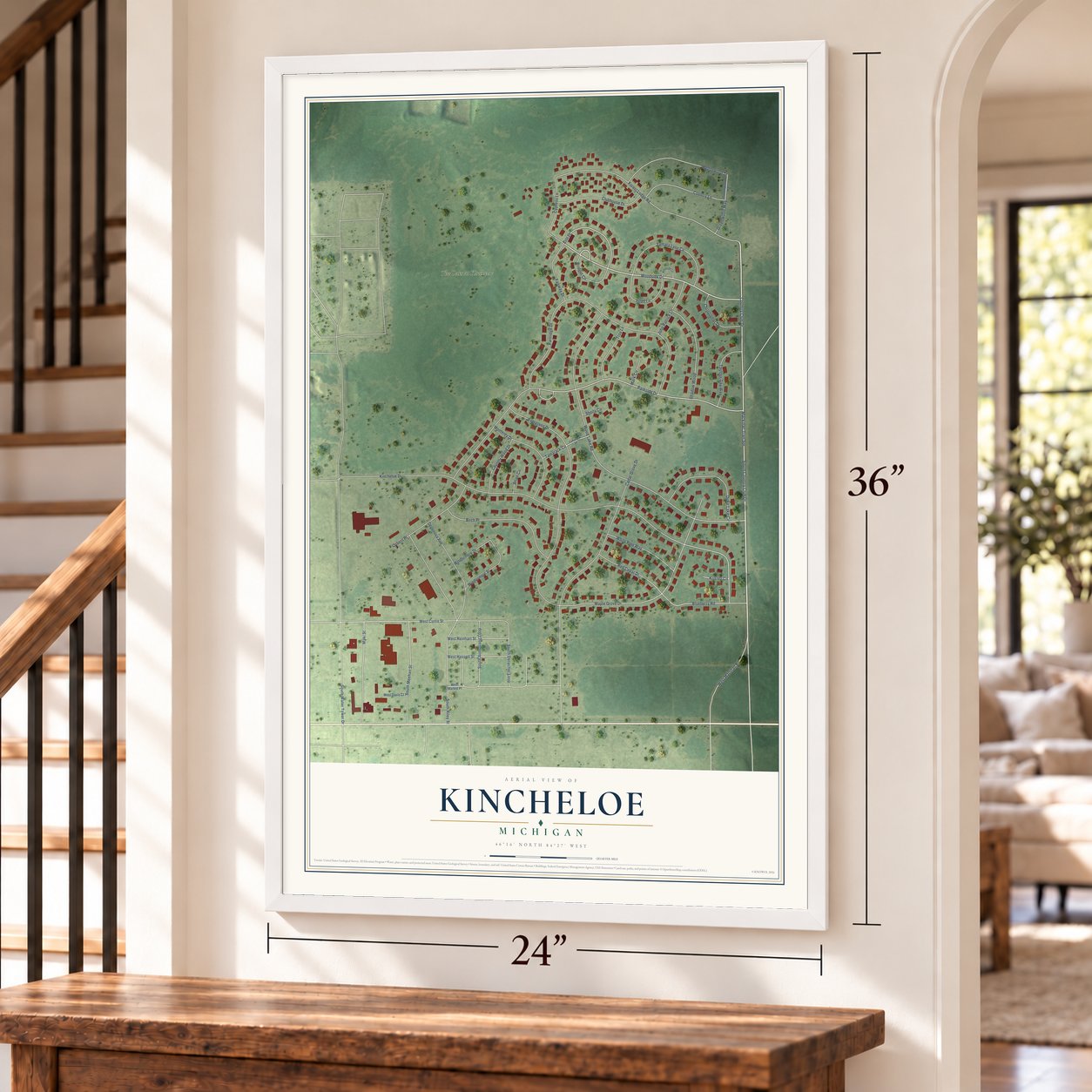 Kincheloe, Michigan map, 24 x 36 inch print in a white frame by a staircase