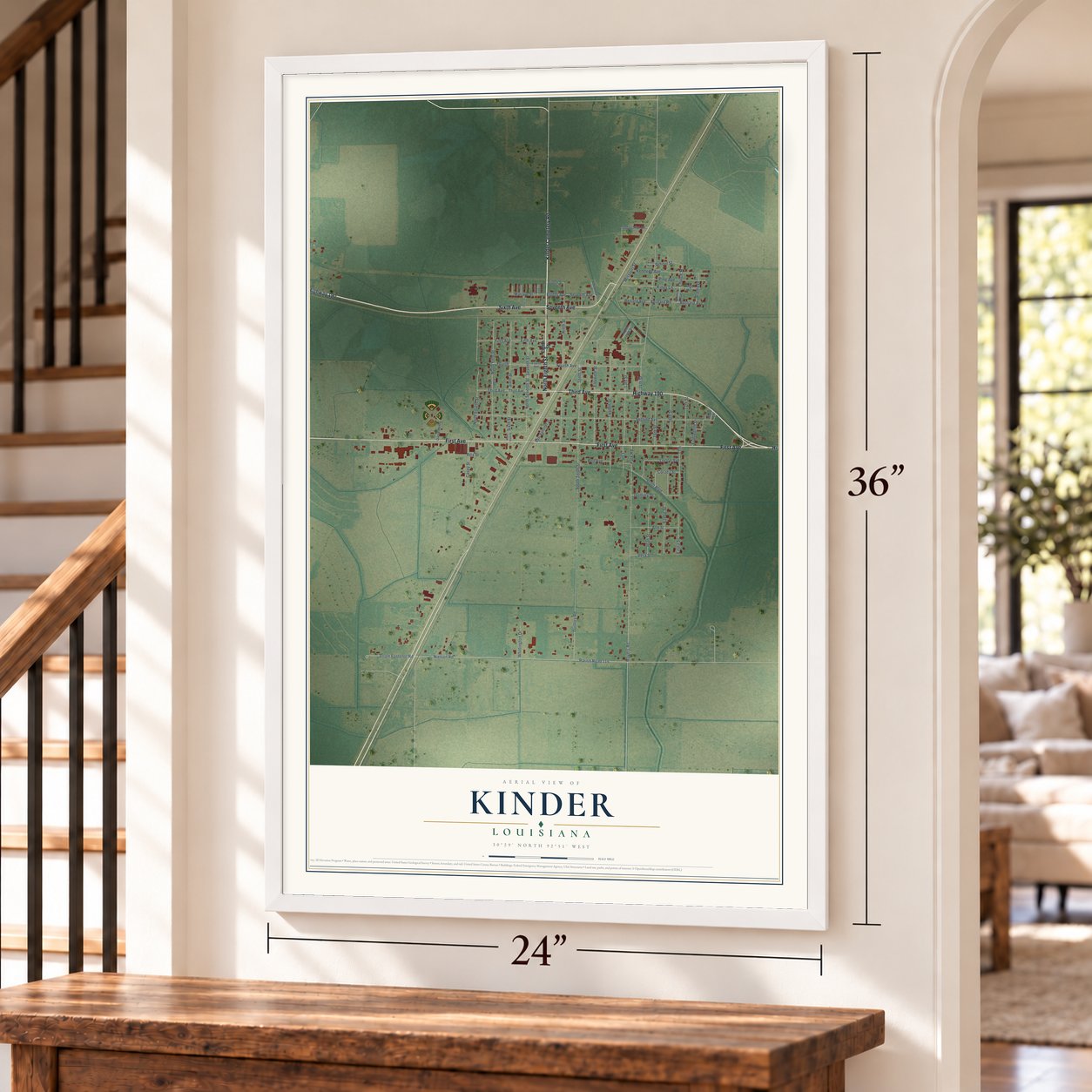 Kinder, Louisiana map, 24 x 36 inch print in a white frame by a staircase