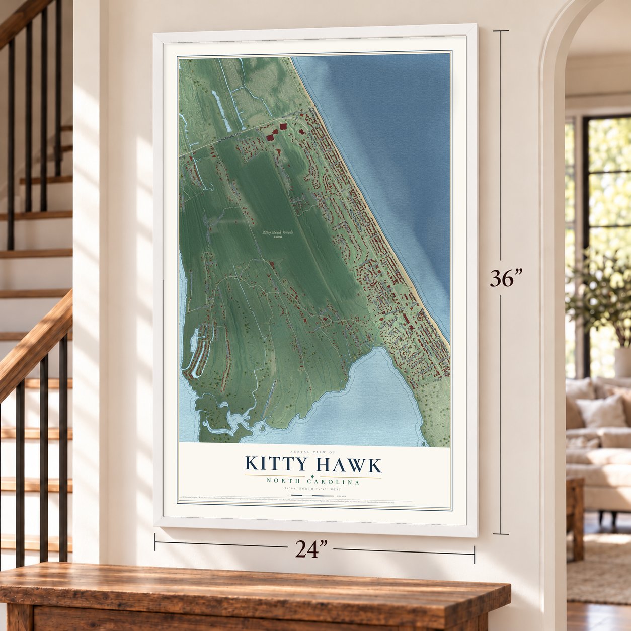 Kitty Hawk, North Carolina map, 24 x 36 inch print in a white frame by a staircase
