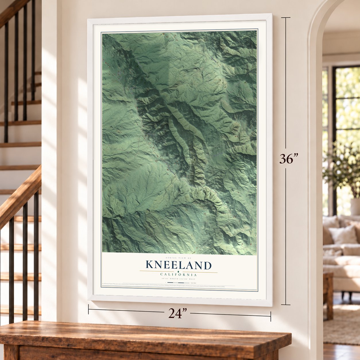 Kneeland, California map, 24 x 36 inch print in a white frame by a staircase